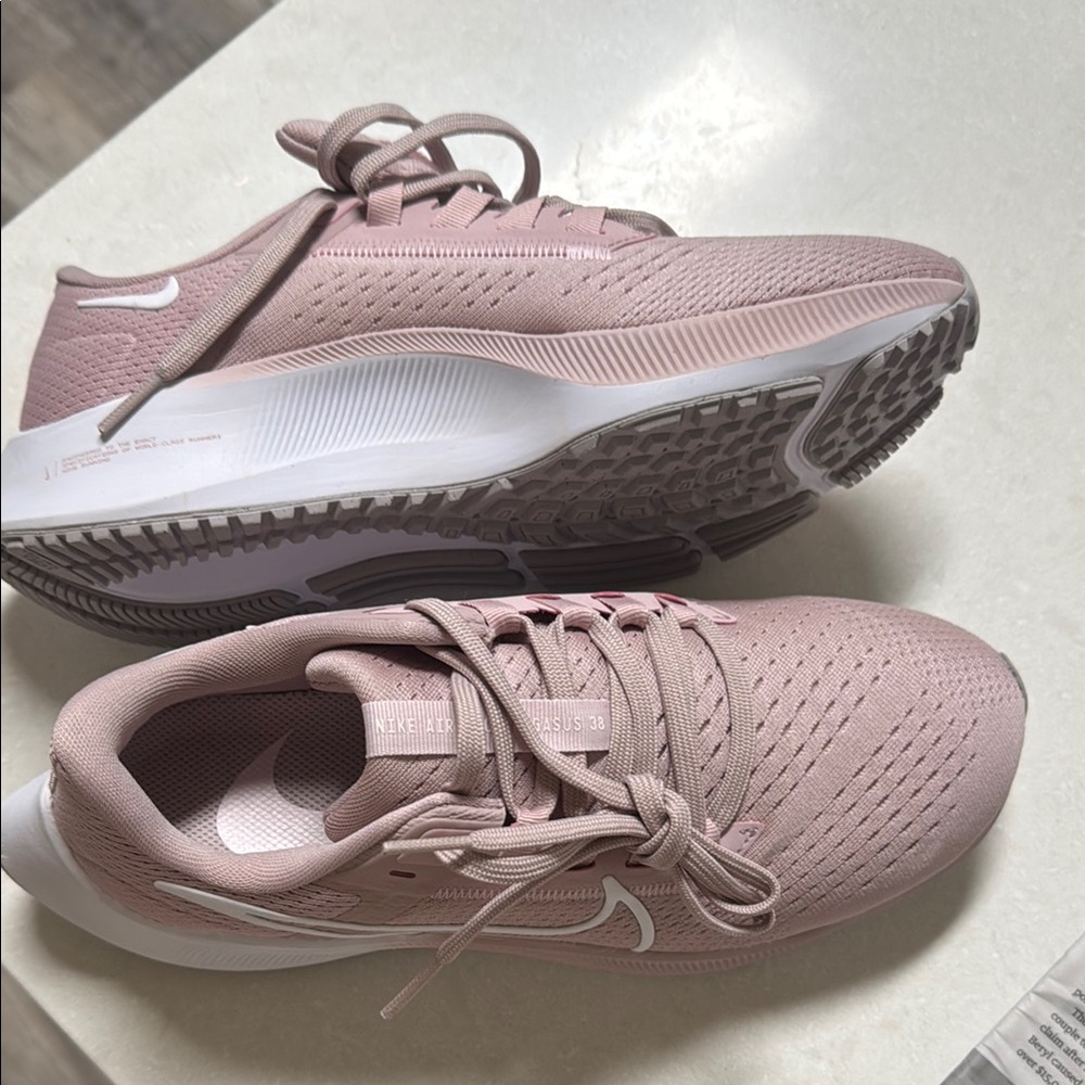 Nike Pink Athletic Shoes with Breathable Fabric and Low-Top Design